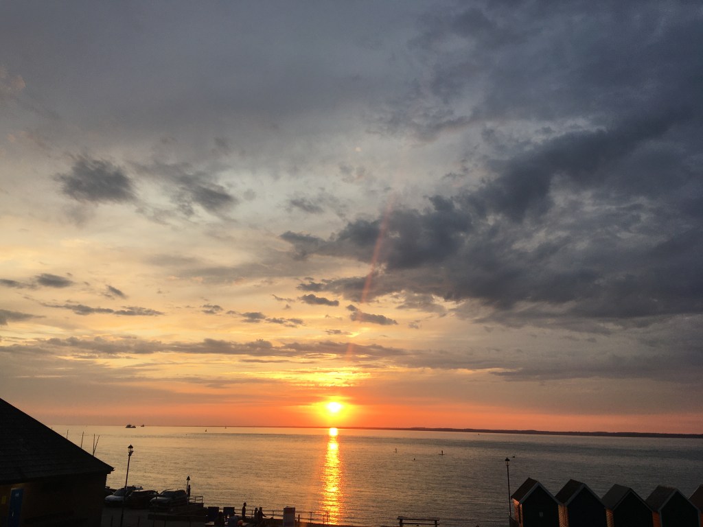 isle of wight; beach hut; gurnard; sea swimming; orange hat ladies; swimming women; wild swimming