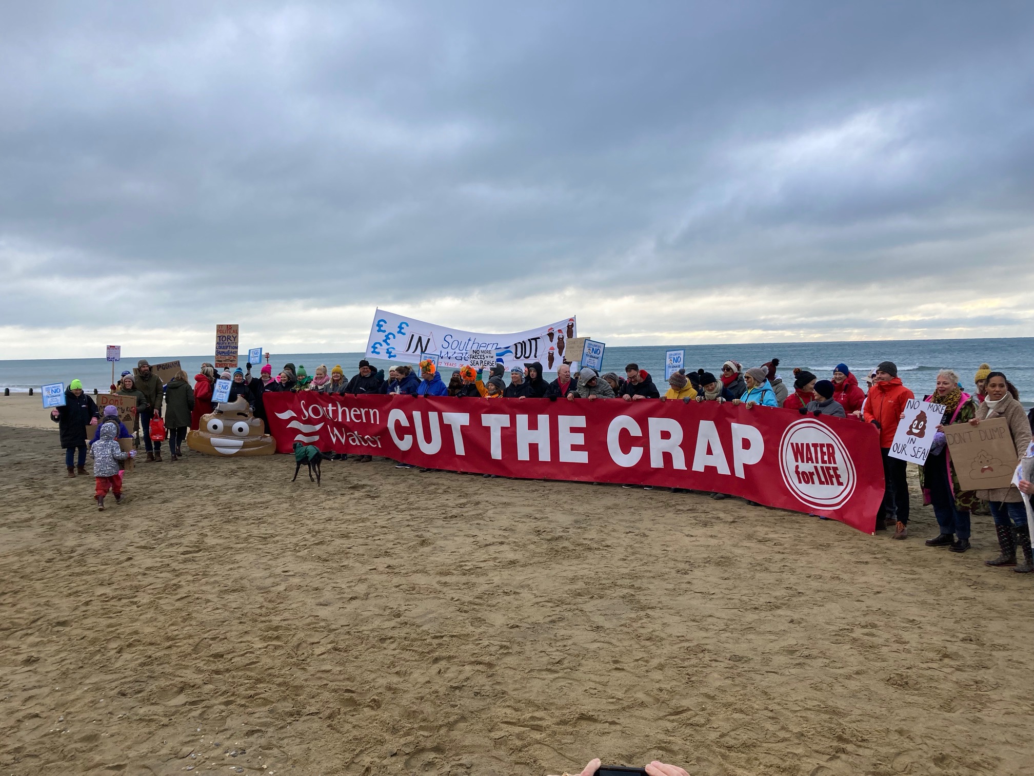 orange hat ladies, surfers against sewage, end the sewage, sea safety, protest