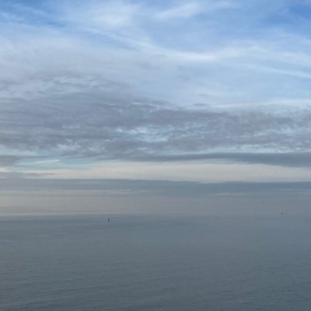 orange hat ladies, grey skies, sea swimming