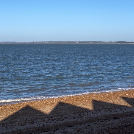 orange hat ladies, long shadows, sea swimming