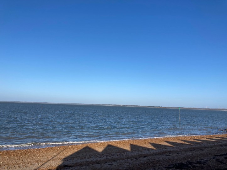 orange hat ladies, sea swimming, blue skies