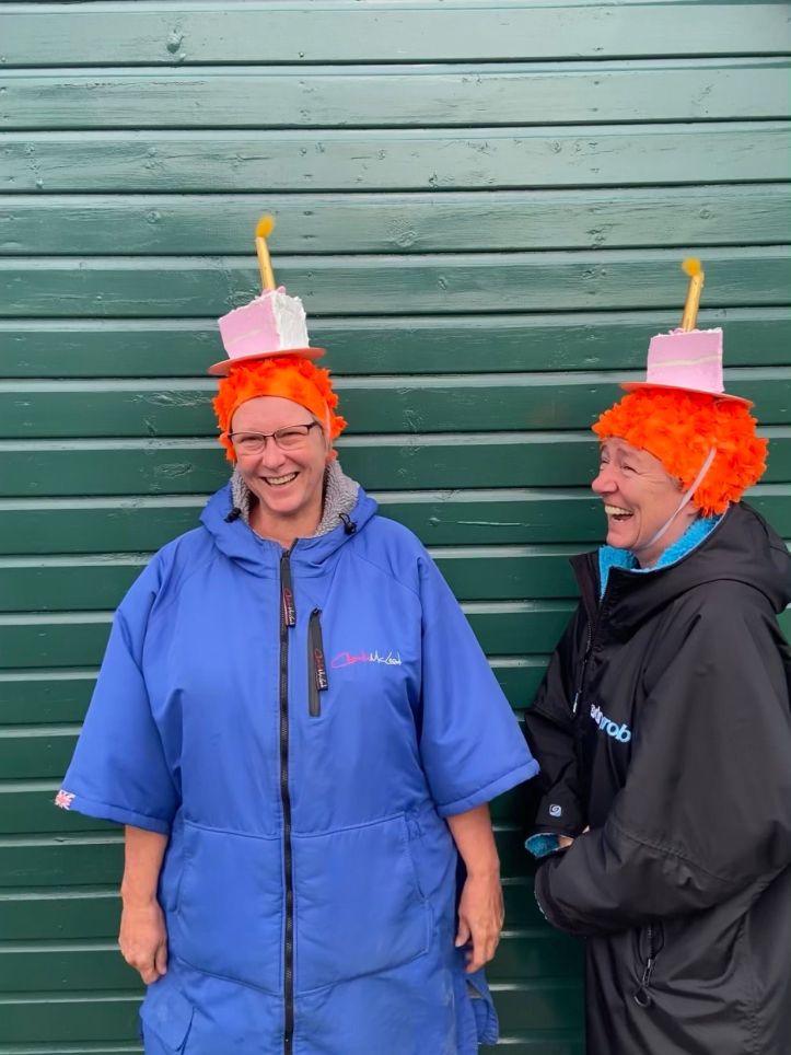 orange hat ladies, sea swimming, friendship, swimming women